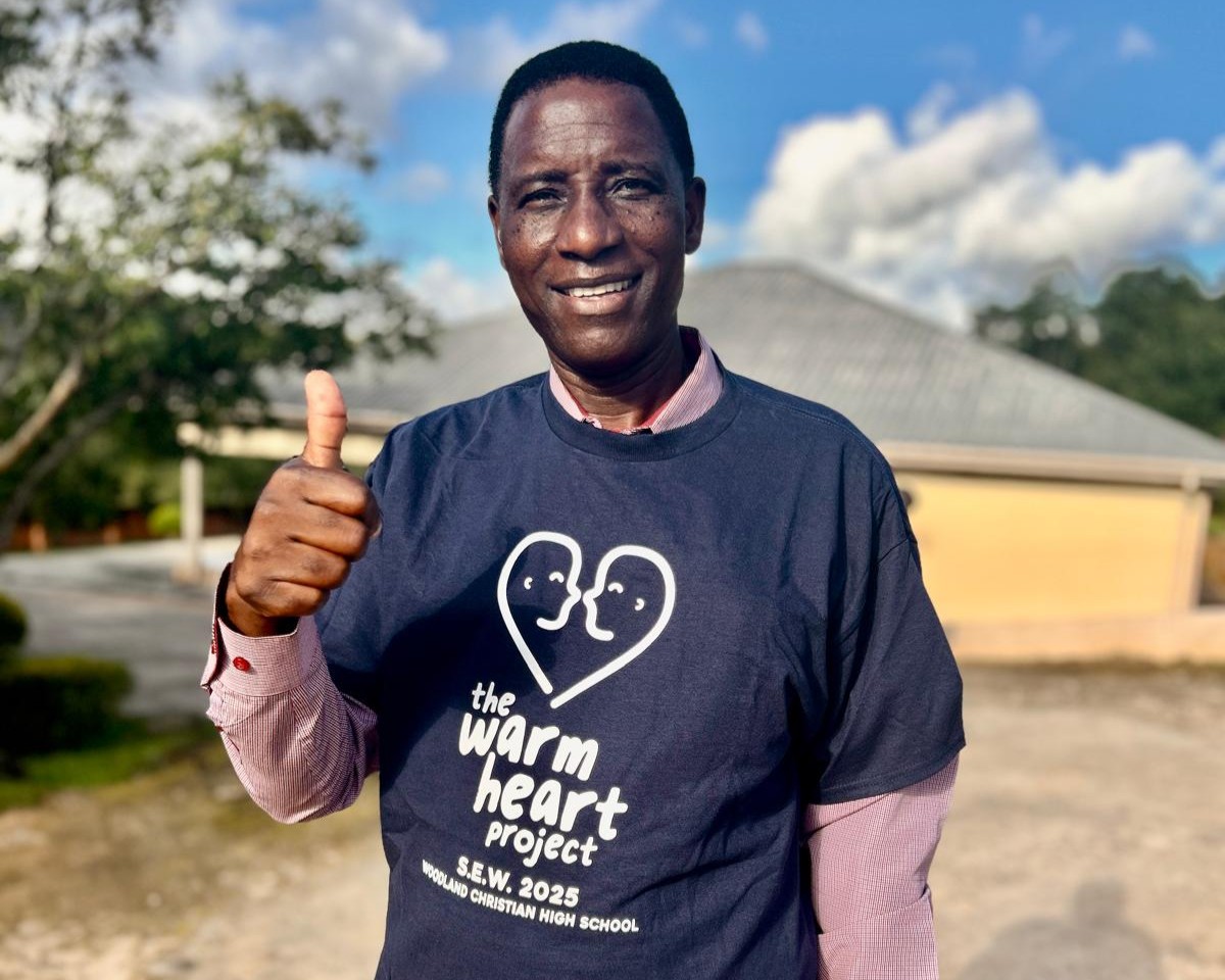 Joseph, CCAP Livingstona's Executive Director of the Education Department, with Woodland's Special Emphasis Week t-shirt!