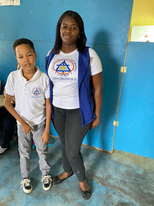 Yeral, a student in the Dominican Republic, and his teacher